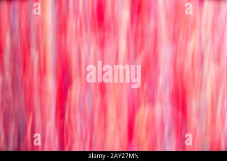 HINTERGRUND MIT ROTER BEWEGUNGSUNSCHÄRFE Stockfoto