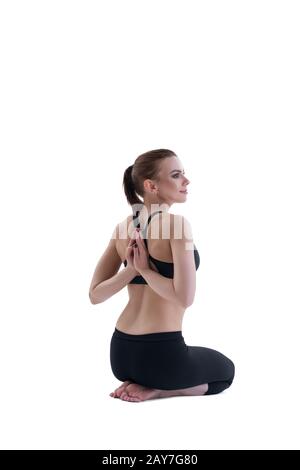 Junge Mädchen Yoga posiert mit Zurück zum Viewer Stockfoto