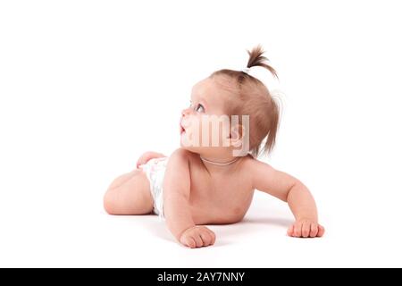 Cute glückliche kleine Mädchen in der Windel liegt Stockfoto