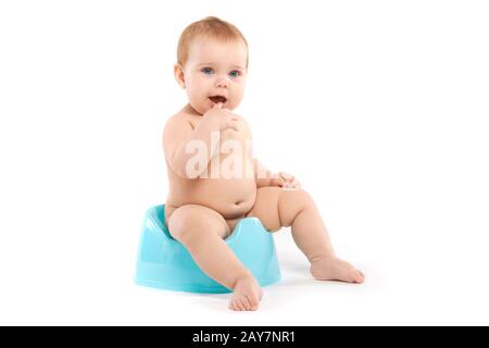 Kind sitzen auf dem Töpfchen Stockfoto