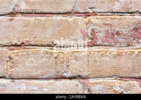 Strukturierter Hintergrund aus der Nähe von mehrlagigen, abblätternden Farben an der Wand. Mischen verschiedener Farben von Farben in den gespaltenen Schichten o Stockfoto