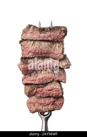 Scheiben eines Steaks auf einer Gabel Stockfoto