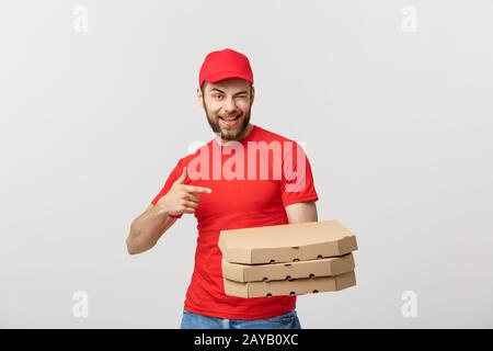 Lieferung Konzept: Stattlichen kaukasischen Pizza Delivery Man Zeigefinger. Über grauer Hintergrund isoliert. Stockfoto
