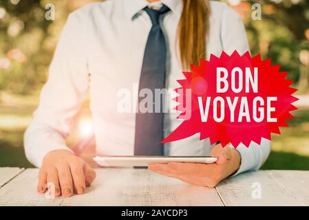 Text schreiben Bon Voyage. Geschäftskonzept für gebrauchte Express Good Wünsche an jemanden über den Start in die Reise Weibliche Geschäft Stockfoto