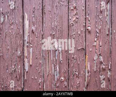 Braune Holzwand mit Schälfarbe Stockfoto