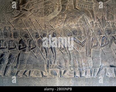 Kambodscha: Thailändische Söldner in einem Flachrelief auf dem westlichen Teil der südlichen Galerie, Angkor Wat. Angkor Wat wurde für König Suryavarman II. (Regierte 1113-50) im frühen 12. Jahrhundert als Staatstempel und Hauptstadt erbaut. Als besterhaltener Tempel am Standort Angkor ist er der einzige, der seit seiner Gründung ein bedeutendes religiöses Zentrum geblieben ist – zuerst Hindu, dem gott Vishnu gewidmet, dann Buddhist. Es ist das größte religiöse Gebäude der Welt. Der Tempel ist an der Spitze der hohen klassischen Stil der Khmer-Architektur. Stockfoto