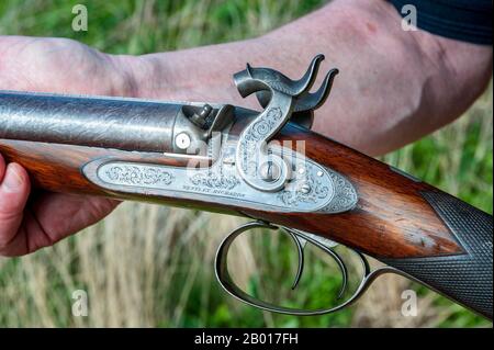 Eine Doppel-Barrel-Schlagschrotflinte mit 11 Bohrungen von Birmingham, England, dem britischen Waffenhersteller Westley Richards, die im Jahr 1841 als Stockpistole für ihren Londoner Agenten William Bishop hergestellt wurde Stockfoto