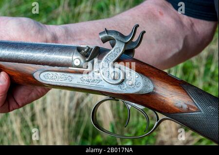 Eine Doppel-Barrel-Schlagschrotflinte mit 11 Bohrungen von Birmingham, England, dem britischen Waffenhersteller Westley Richards, die im Jahr 1841 als Stockpistole für ihren Londoner Agenten William Bishop hergestellt wurde Stockfoto