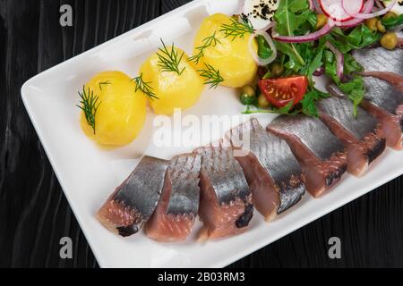 Gesalzener Hering in Scheiben Stockfoto
