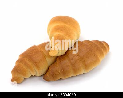 Drei Croissants vor weißem Hintergrund Stockfoto