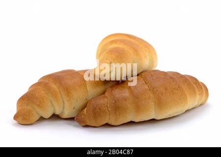 Drei Croissants vor weißem Hintergrund Stockfoto