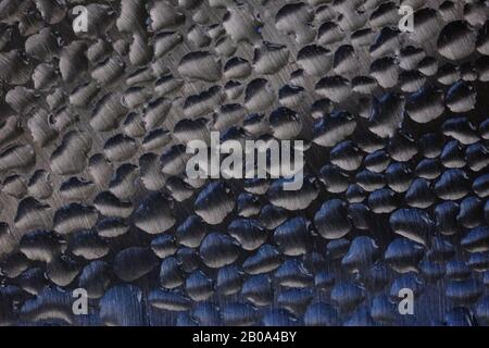 Wassertropfen auf Stahl Stockfoto