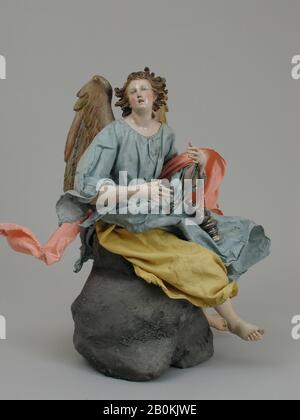 Giuseppe Gori, Angel, Italienisch, Neapel, Zugeschrieben Giuseppe Gori (aktiv ca. 1770/1810), zweite Hälfte des 18. Jahrhunderts, Italiener, Neapel, polychromer Terrakotta-Kopf; Holz-Gliedmaßen und Flügel; Drahtkörper im Schleppzug; verschiedene Stoffe, H. 15 1/4 Zoll (38,7 cm.), Crèche Stockfoto