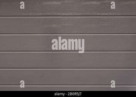Vorderseite einer grauen Garagentortextur Stockfoto