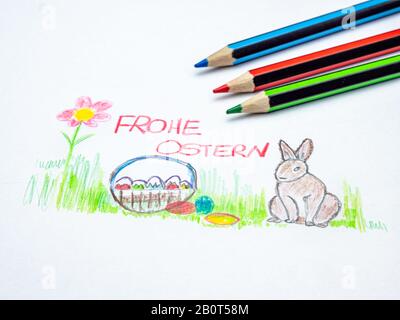 Frohe Ostern mit farbigen Bleistiften auf deutsch gemalt Stockfoto