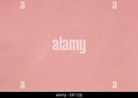 Flache Hintergrundtextur aus rosafarbenem Fleece, weiche, mit einer Kappe bedeckte Isolierschicht aus Polyester Stockfoto