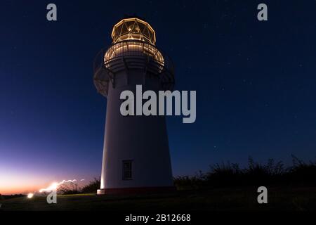 Das erste Licht des Tages im East Cape Lighthouse, North Island, Neuseeland Stockfoto