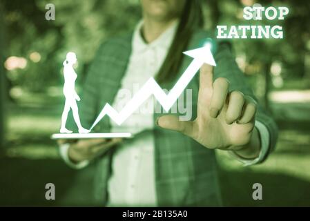 Ein Textzeichen mit der Anzeige "Essen beenden". Die Präsentation von Geschäftsfotos beendet die Aktivität, Lebensmittel in den Mund zu nehmen oder in den Mund zu nehmen Stockfoto