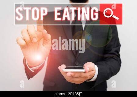 Text Zeichen zeigen Aufhören zu essen. Business Foto Text die Aktivität des Setzens oder Nahrung in den Mund nicht mehr Stockfoto