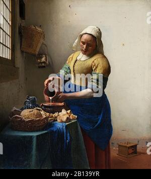 Das Milchmädchen (Maiddiener Gießt Milch) (ca. 1660) von Johannes Vermeer - Gemälde Aus der Zeit des niederländischen Barock aus dem 17. Jahrhundert Stockfoto