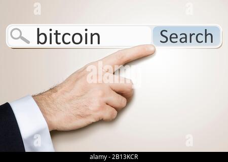 3D-Computergrafik, die Hand zeigt auf einen Schriftzug auf einer BITCOIN-WAND Stockfoto
