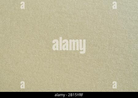 Textur von beigefarbenem handgefertigtem Papier im Makro Stockfoto