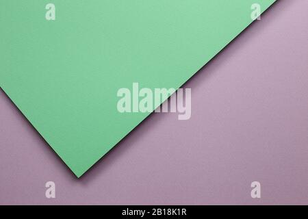 Abstrakter grün-violetter Farbpapierhintergrund Stockfoto