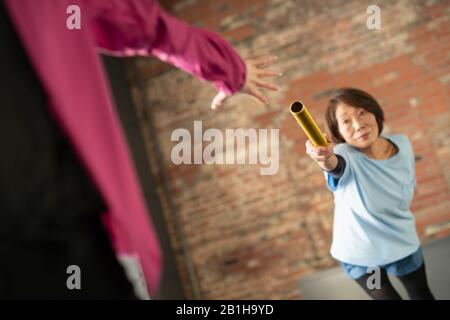 Die Weitergabe von Baton über Generationen Stockfoto