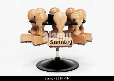 In einer Stempelablage hängt ein Stempel mit der Aufschrift Sonntag (Sonntag) Stockfoto