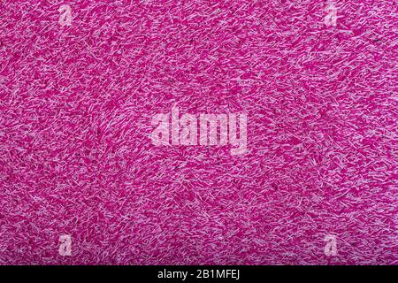 Teppichbelag Hintergrund. Muster und Struktur des pinkfarbenen Teppichs. Kopierbereich. Stockfoto