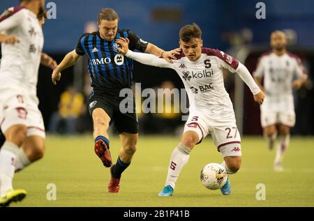 Montreal, Quebec, Kanada. Februar 2020. Montreal Impact #6 Samuel Piette und Saprissa Deportivo #27 Manfred Ugalde während der ersten Hälfte in einem CONCACAF Champions League Fußballspiel. Kredit: Patrice Lapointe/ZUMA Wire/Alamy Live News Stockfoto