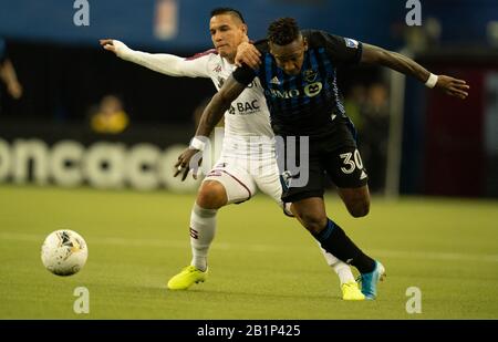 Montreal, Quebec, Kanada. Februar 2020. Montreal Impact #30 Romell Quioto und Deportivo Saprissa #8 David Guzmán während der ersten Halbzeit in einem CONCACAF Champions League Fußballspiel. Kredit: Patrice Lapointe/ZUMA Wire/Alamy Live News Stockfoto