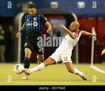 Montreal, Quebec, Kanada. Februar 2020. Deportivo Saprissa #12 Ricardo Blanco im Einsatz mit Montreal Impact #26 Jorge Corrales in einem CONCACAF Champions League Fußballspiel. Kredit: Patrice Lapointe/ZUMA Wire/Alamy Live News Stockfoto