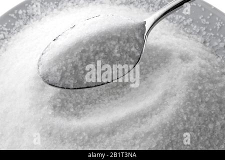 Feiner Kristall Zucker auf einem Loeffel Stockfoto