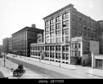 Eastman KODAK Vintage B&W Büro- und Fabrikgebäude 1905 Pferd gezeichnete Karre im Vordergrund. Eastman Kodak Company Fabrik und Hauptniederlassung in Rochester, New York USA Stockfoto