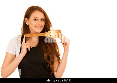 Fröhlicher, junger Koch kocht isoliert über Weiß Stockfoto