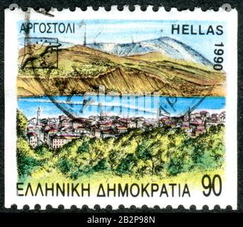 Griechenland - CIRCA 1990: Eine in Griechenland gedruckte Briefmarke zeigt die kleine Stadt Agostoli, Hauptstadt der Regionaleinheit Kefalonia, ca. 1990 Stockfoto