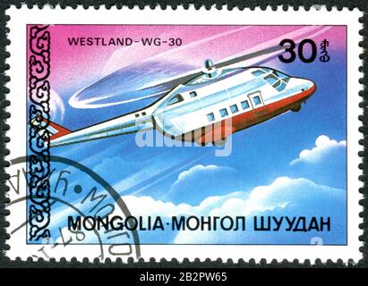 Mongolia - CIRCA 1987: Eine in der Mongolei gedruckte Briefmarke, die den britischen Mittelhubschrauber Westland-WG 30, ca. 1987, abbildete Stockfoto