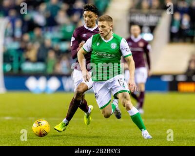 Easter Road, Edinburgh, Großbritannien. März 2020. Scottish Premiership Football, Hibernian versus Heart of Midlothian; Greg Docherty von Hibernian erhält Sean Clare of Hearts Credit: Action Plus Sports/Alamy Live News Stockfoto