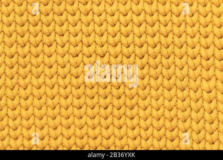 Gelb Senf Farbe gestrickt Stoff Textur Hintergrund Stockfoto