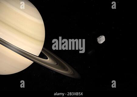 Janusmond umkreist den Saturnplaneten im Weltraum. 3D-Rendering Stockfoto