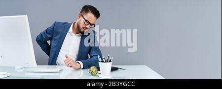 Business Man With Back Pain Holding His Aching Hip Stockfoto