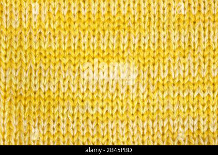 Gelb gestrickter strukturierter Hintergrund Stockfoto