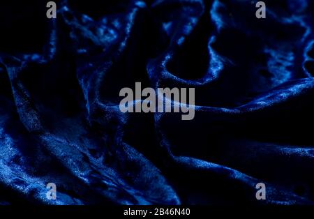 Hintergrund aus dunkelblauem Samtmaterial Stockfoto