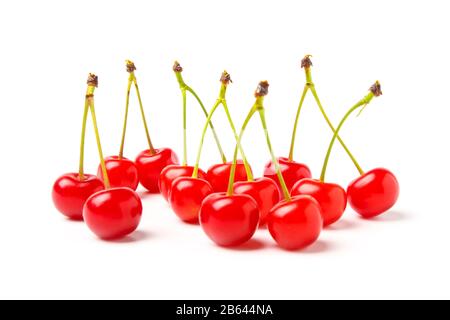 Handvoll Beeren süße Kirschen isoliert auf Weiß Stockfoto