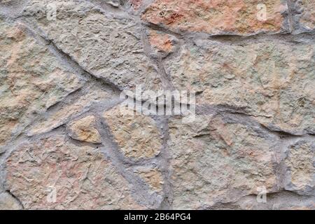 Zerkleinerter Wandhintergrund aus Granit, Textur In Der Nähe. Stockfoto