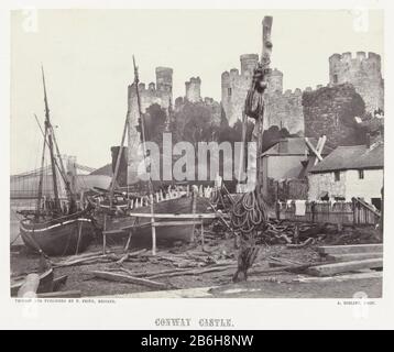 Conway Castle, mit Schiffen im Vordergrund Conway Castle (Titelobjekt) Conway Castle, mit Schiffen im voorgrondConway Castle (Titelobjekt) Objekttyp: Fotos Artikelnummer: RP-F F80308 Hersteller: Fotograf Alfred Rosling (denkmalgeschütztes Gebäude) Drucker: Francis Frith (Listed Building) Herausgeber: Francis Frith (Listed Property) Ort Herstellung: Großbritannien Datum: 1860 - 1880 Physikalische Merkmale: Albumindrucke auf Papier auf Pappe mit altem Rahmenmaterial: Papierkartontechnik: Albumindrucke Abmessungen: Foto: H 157 mm × W 203 mmblad: H 290 mm × b 371 mmOnderwerp Stockfoto