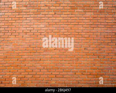 Hintergrund der roten Ziegelwand. Nahtlose Wandstruktur aus Backstein. Stockfoto