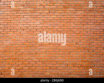 Hintergrund der roten Ziegelwand. Nahtlose Wandstruktur aus Backstein. Stockfoto