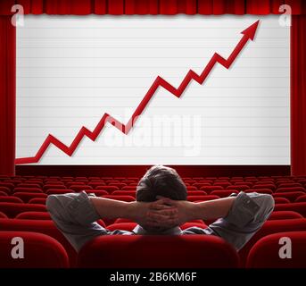 Mann sitzt und schaut mit wachsendem Finanzdiagramm auf den Bildschirm Stockfoto